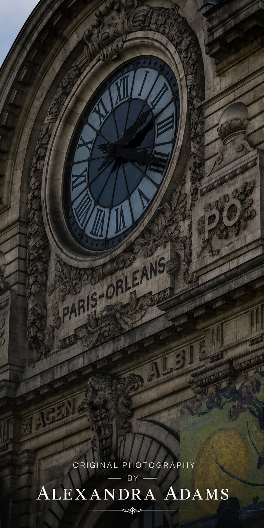 A low-angle photograph of the ornate Paris-Orleans clock face on a stone building facade, with carved architectural details and the text 'PARIS-ORLEANS' and 'ALEXANDRA ADAMS' visible.