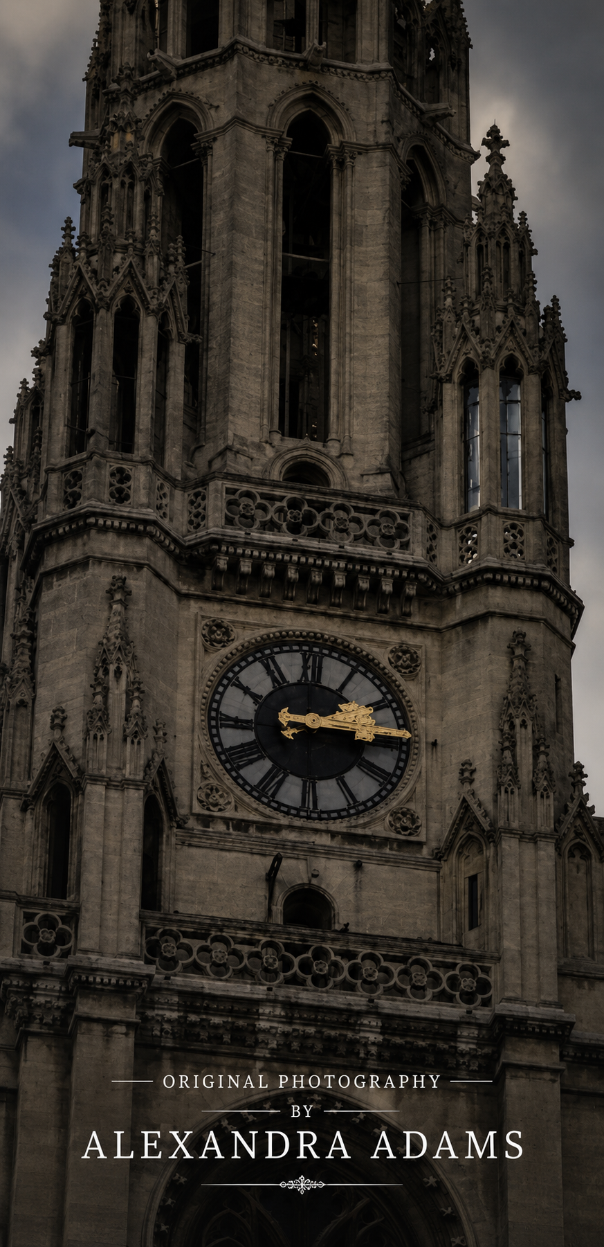 A dramatic, low-angle photograph of the ornate gothic tower of the Munich City Hall, featuring a large clock with gold hands against a dark, moody sky. The text 'ORIGINAL PHOTOGRAPHY BY ALEXANDRA ADAMS' is displayed at the bottom.